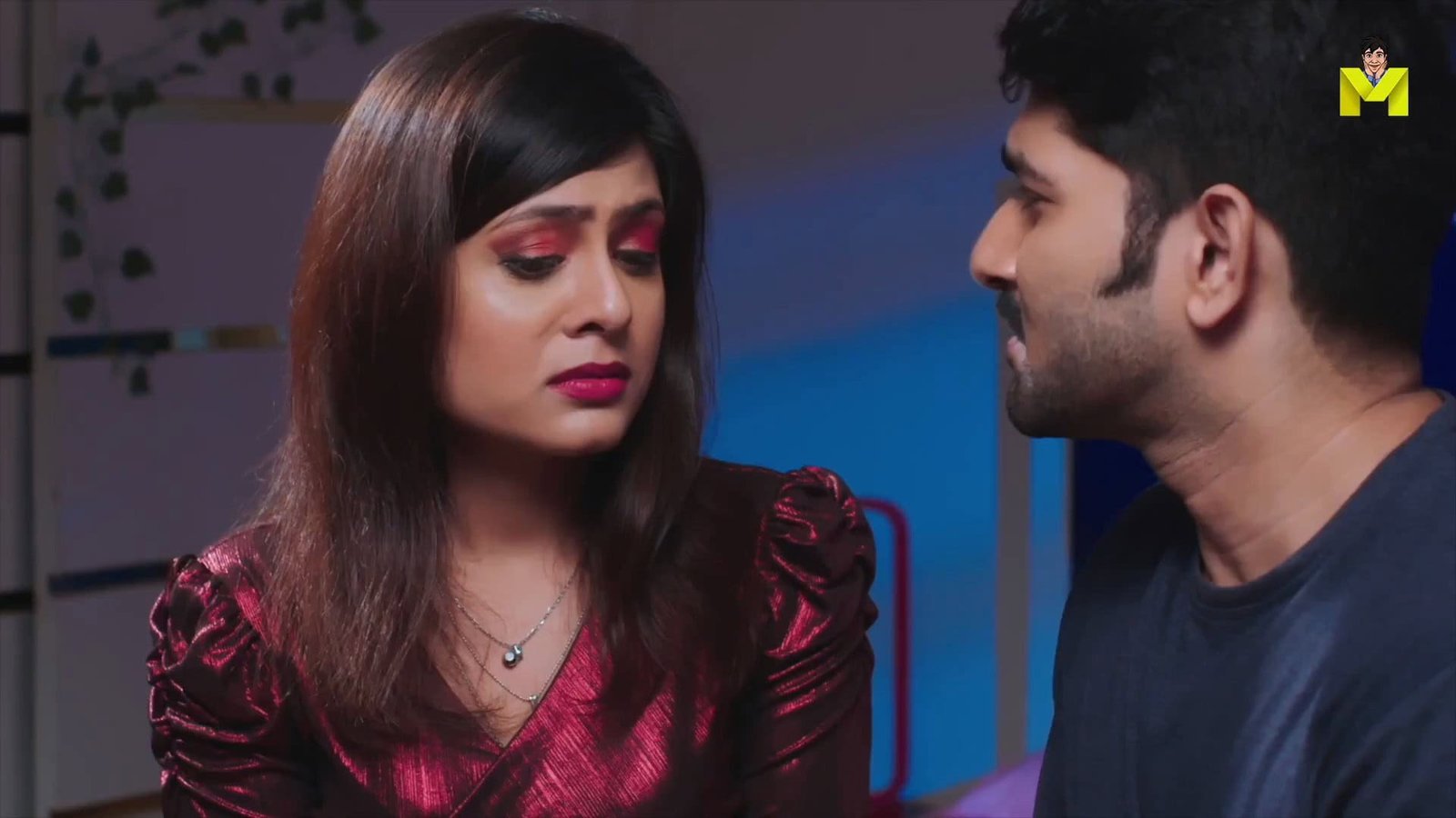 Close-up of a woman and man having an intense conversation, highlighting emotional interaction.