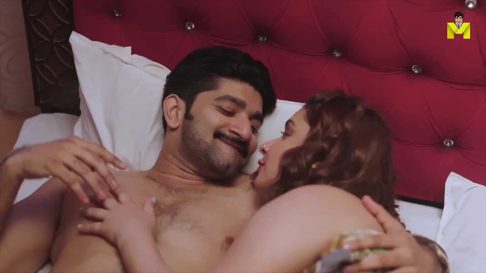 Spicy romantic scene from 1Filmy4wap 2022, featuring intimate moments in a bedroom setting.
